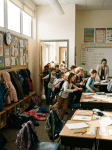 Chaotic classroom before breaktime, kids rushing out